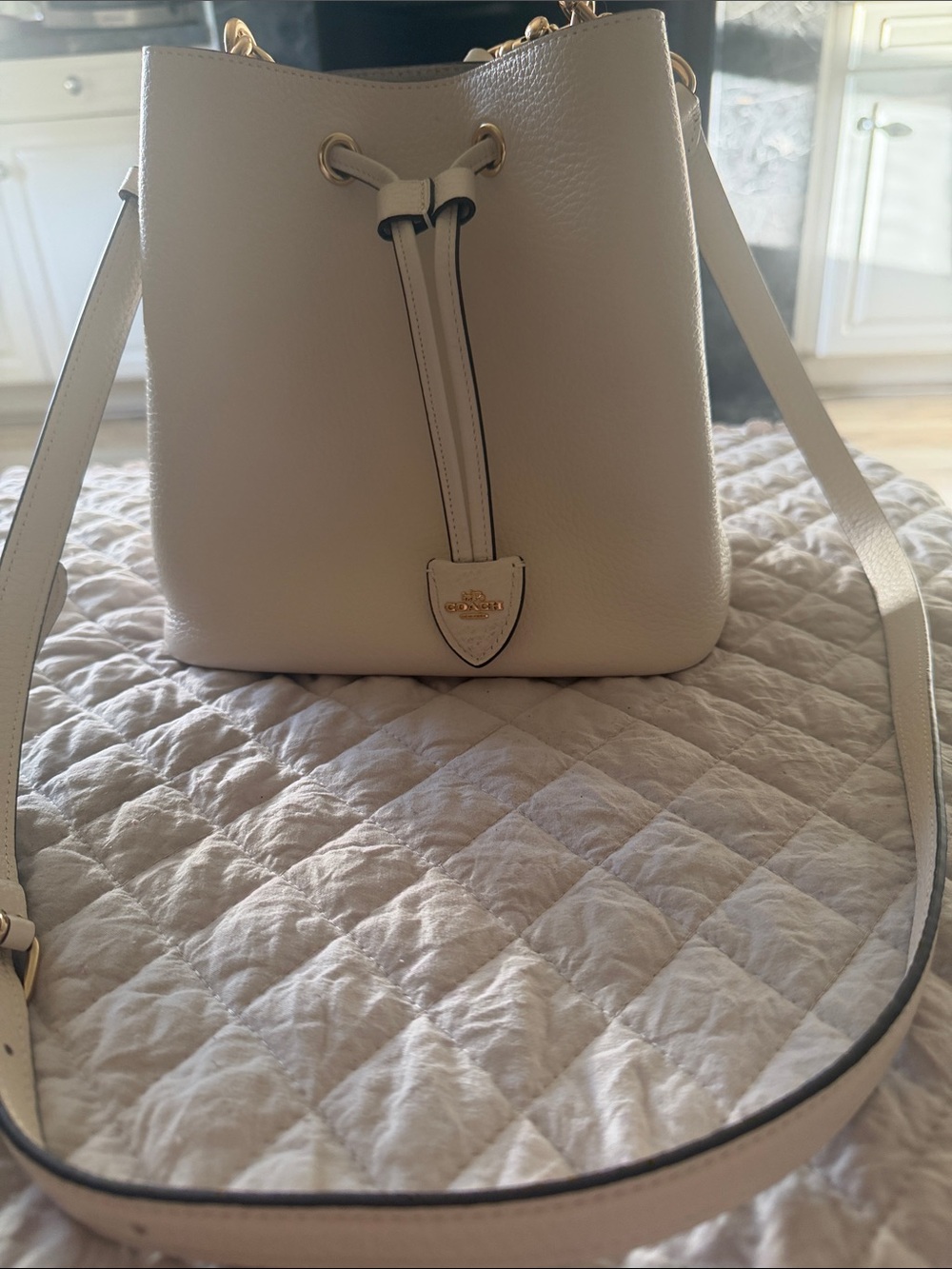 Coach Pebbled Leather Drawstring Bucket Bag in Cream with Gold Hardware